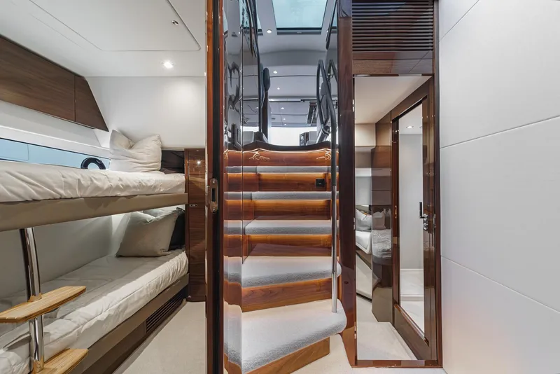 Slide: The Image of Interior of 2025 Princess V55 yacht with bunk beds and wooden stairs. - 47