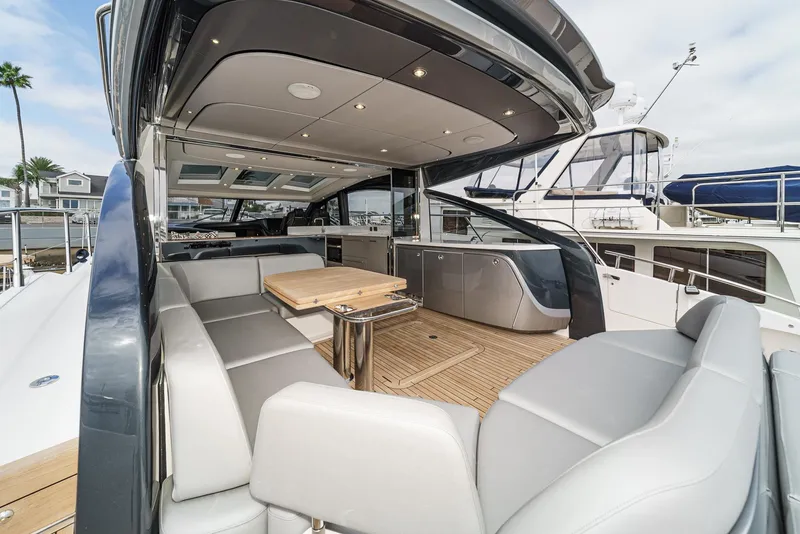 Slide: The Image of Luxurious 2025 Princess V55 yacht interior with sleek seating and modern design. - 9