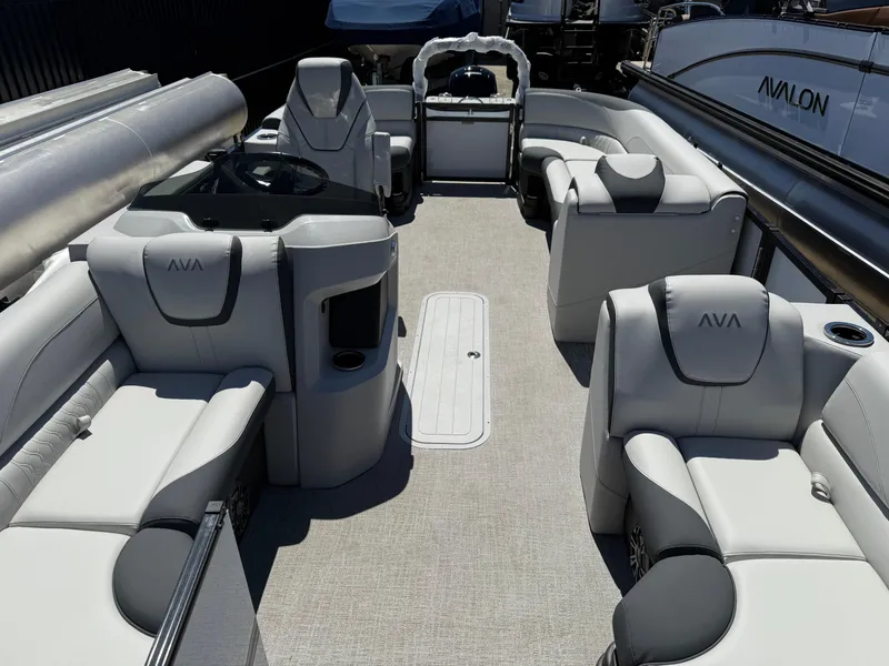 Slide: The Image of 2025 Avalon 2185 LSZ QL pontoon boat interior with luxurious seating and modern design. - 2