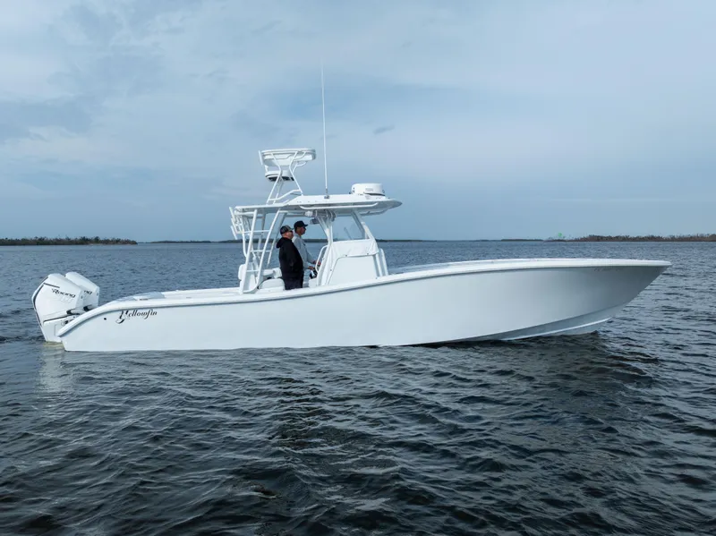 Slide: The Image of 2021 Yellowfin 36 Offshore boat on calm water, side view. - 0
