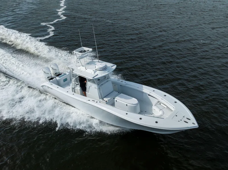Slide: The Image of 2021 Yellowfin 36 Offshore boat cruising on open water. - 12