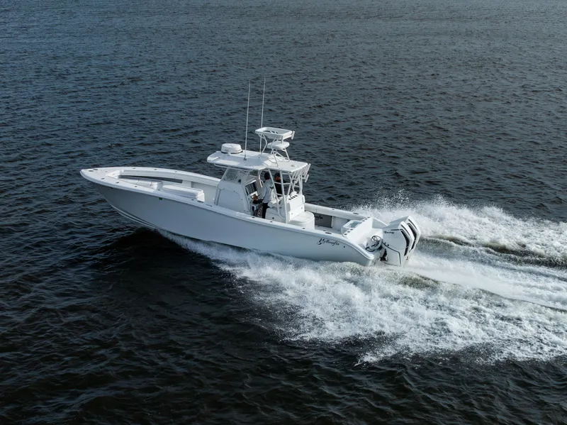 Slide: The Image of 2021 Yellowfin 36 Offshore boat cruising on open water. - 13