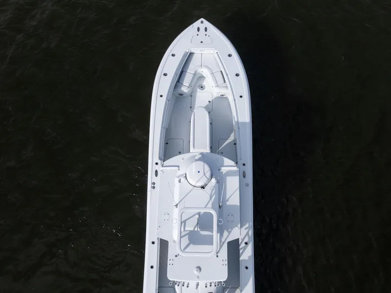 Slide: The Image of 2021 Yellowfin 36 Offshore boat, aerial view, on dark water. - 15