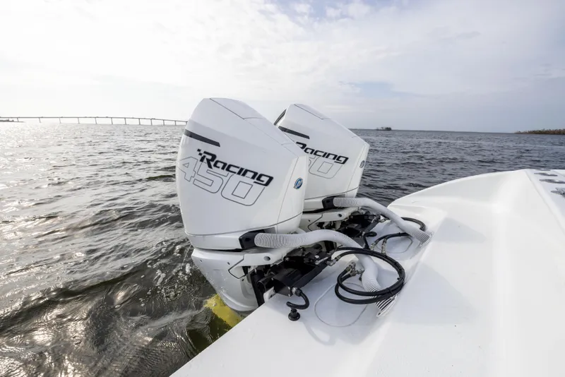 Slide: The Image of 2021 Yellowfin 36 Offshore boat with twin Racing 450 outboard engines on open water. - 24