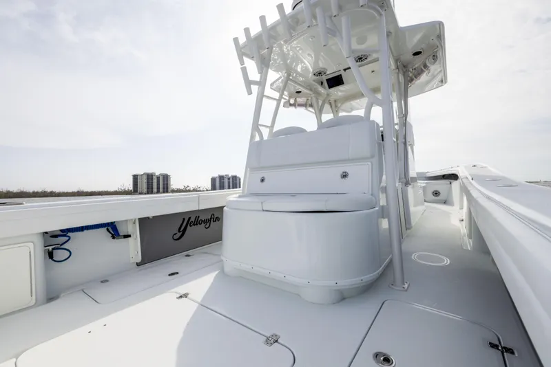 Slide: The Image of 2021 Yellowfin 36 Offshore boat interior, featuring sleek white design and spacious deck. - 29