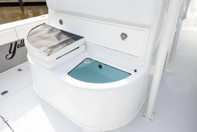 Slide: The Image of 2021 Yellowfin 36 Offshore boat with open storage compartment and sleek white design. - 33