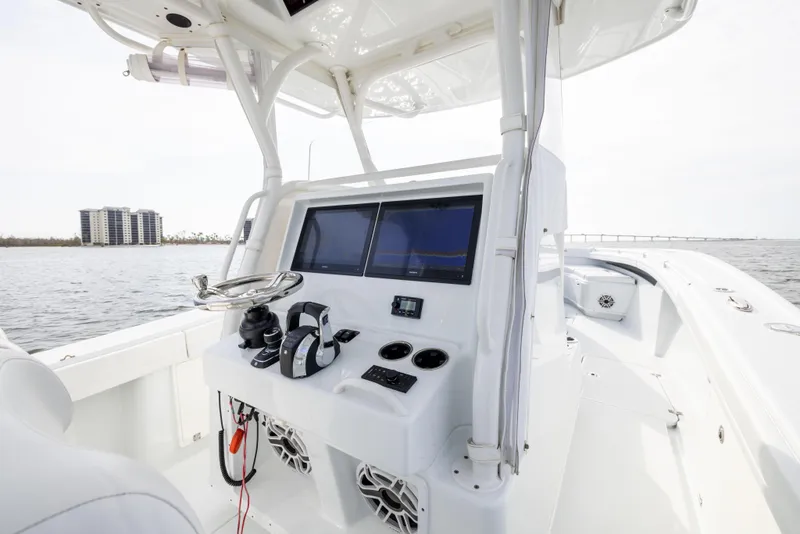 Slide: The Image of 2021 Yellowfin 36 Offshore boat console with dual screens on open water. - 39