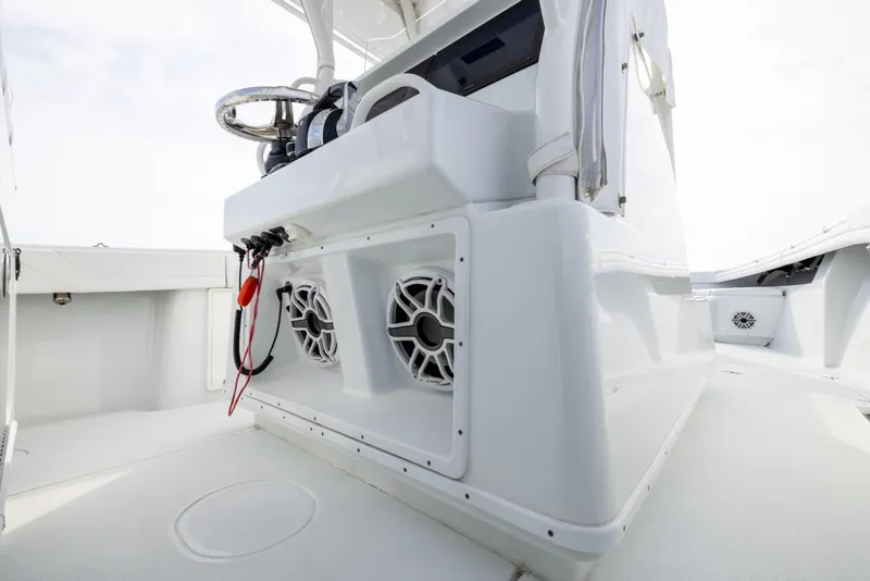 Slide: The Image of 2021 Yellowfin 36 Offshore boat interior with steering console and speakers. - 40