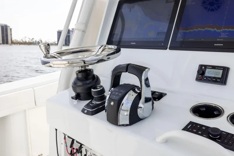 Slide: The Image of 2021 Yellowfin 36 Offshore boat dashboard with modern controls and navigation screens. - 41