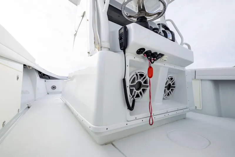 Slide: The Image of 2021 Yellowfin 36 Offshore boat interior with steering wheel and control panel. - 42