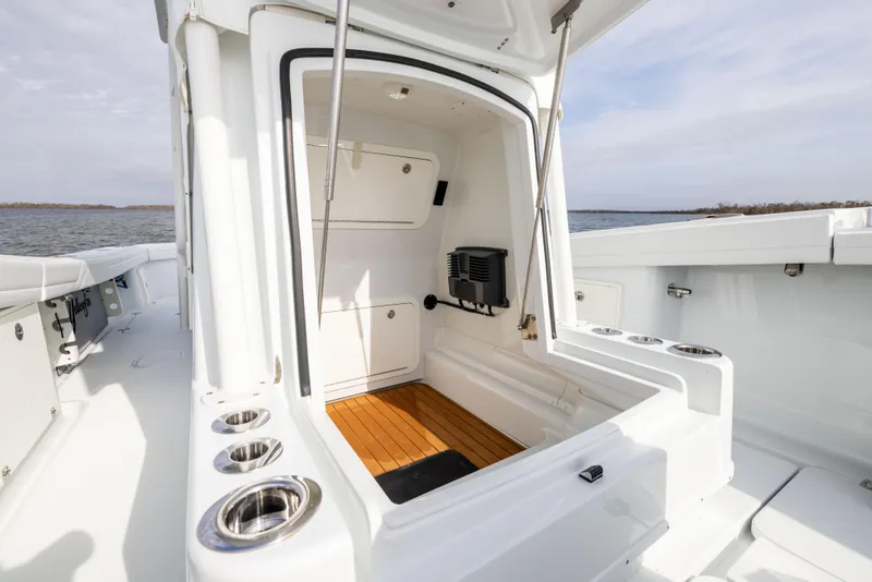 Slide: The Image of 2021 Yellowfin 36 Offshore boat interior with sleek white design and wood flooring. - 45