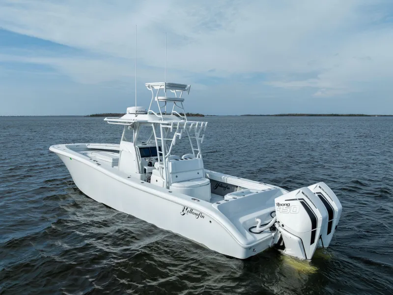 Slide: The Image of 2021 Yellowfin 36 Offshore boat on open water, featuring twin outboard engines. - 5