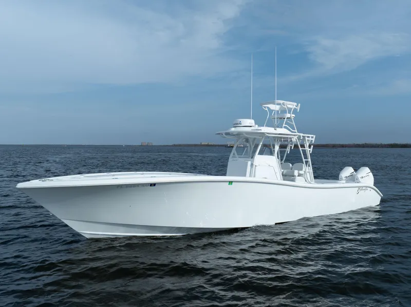 Slide: The Image of 2021 Yellowfin 36 Offshore boat on open water under clear sky. - 6
