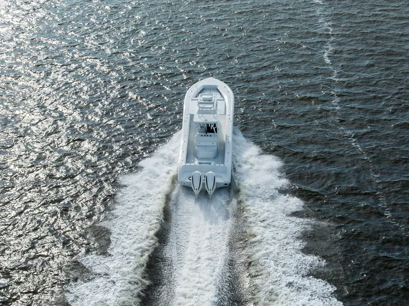 Slide: The Image of Aerial view of 2021 Yellowfin 36 Offshore boat cruising on open water. - 8