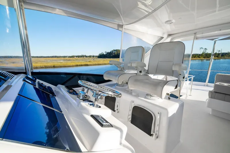 Slide: The Image of Luxurious interior of 2016 Hatteras M60 yacht with modern seating and decor. - 16