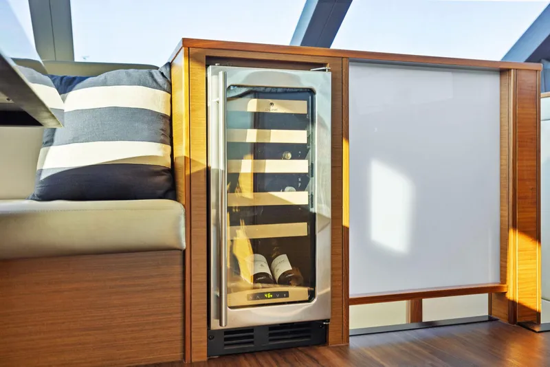 Slide: The Image of Luxurious interior of 2016 Hatteras M60 yacht with elegant cabinetry and scenic window view. - 25