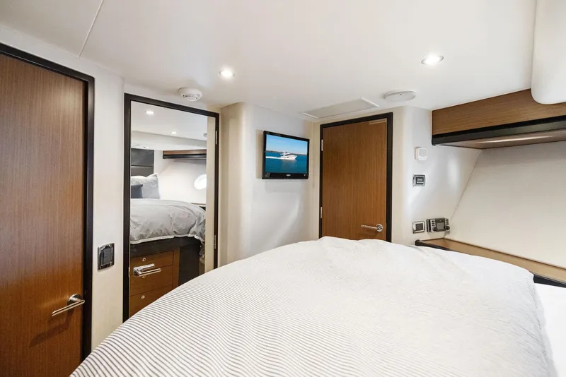 Slide: The Image of Luxurious bathroom in 2016 Hatteras M60 yacht with shower, toilet, and sink. - 31
