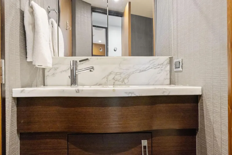 Slide: The Image of Shower area in 2016 Hatteras M60 yacht, featuring sleek design and modern fixtures. - 33