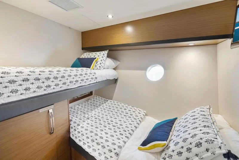 Slide: The Image of Compact laundry area in 2016 Hatteras M60 yacht with stacked washer and dryer. - 35