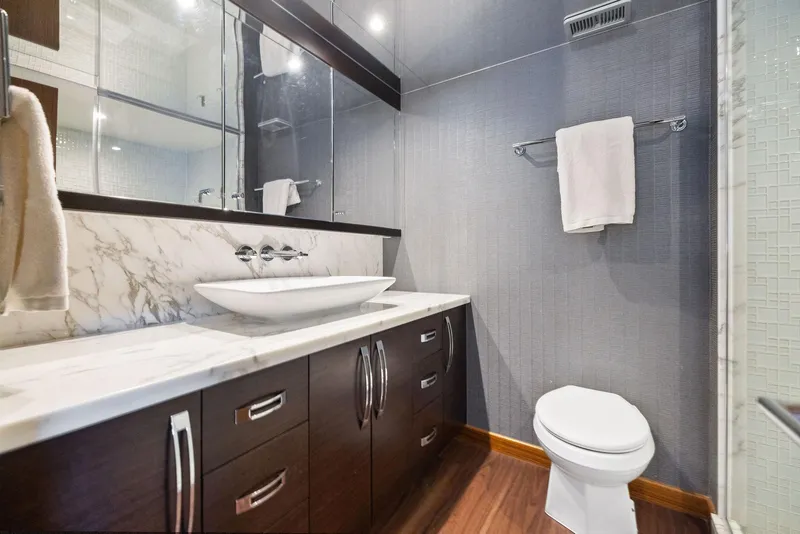 Slide: The Image of Luxurious bathroom in 2016 Hatteras M60 yacht with marble countertop and modern sink. - 40
