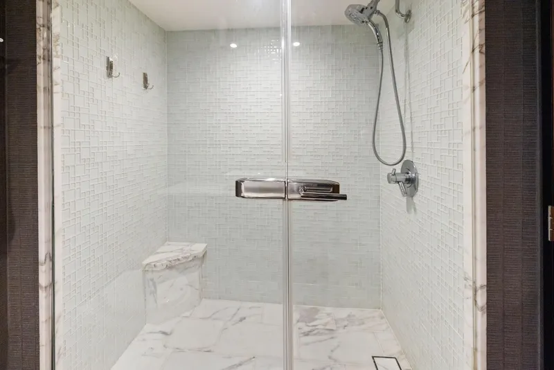 Slide: The Image of Engine room of 2016 Hatteras M60 yacht, showcasing dual engines and intricate piping. - 42