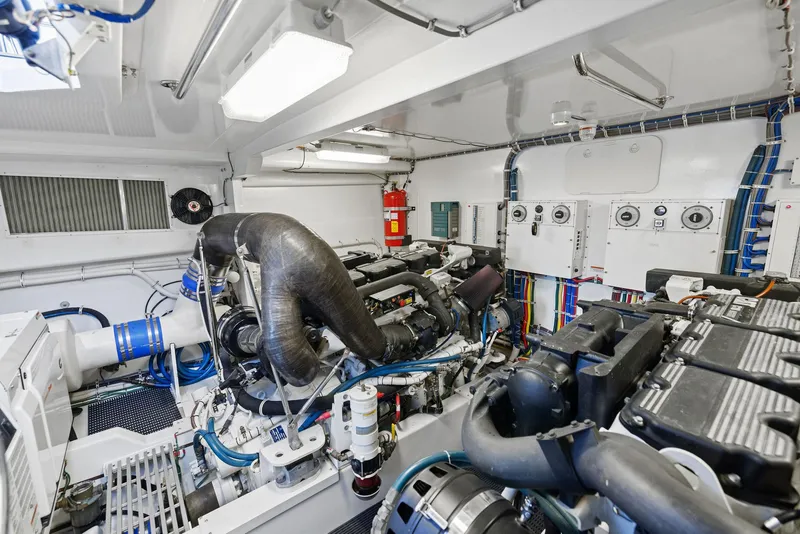 Slide: The Image of Engine room of 2016 Hatteras M60 yacht, showcasing mechanical components and equipment. - 46
