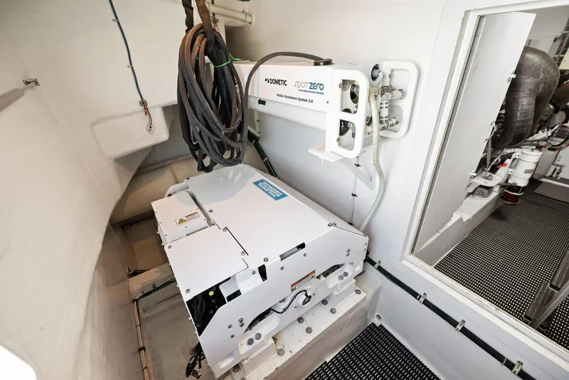 Slide: The Image of Engine room of 2016 Hatteras M60 yacht, showcasing advanced machinery and equipment. - 48