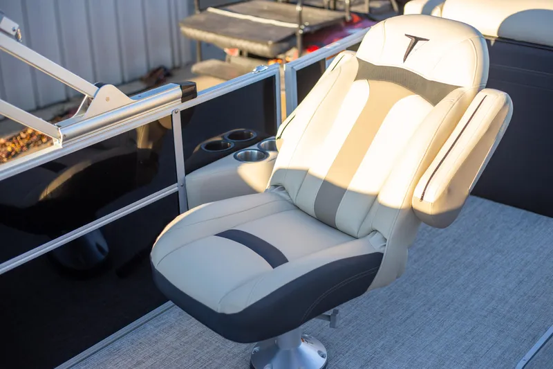 Slide: The Image of 2025 Trifecta 24UL CS boat seat with cup holders and sleek design. - 10