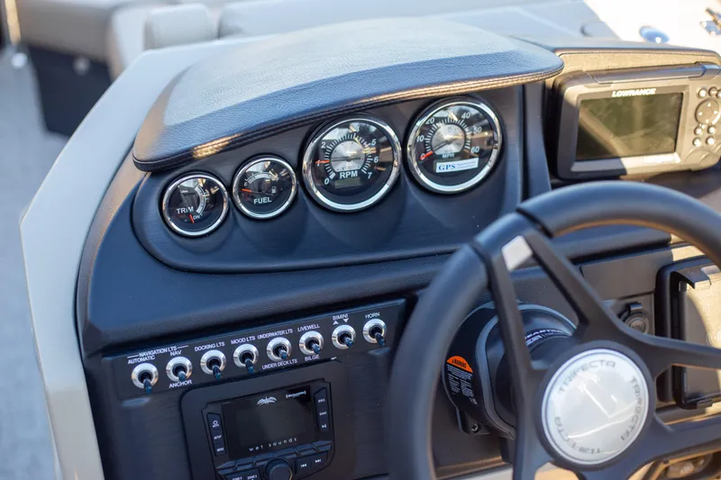 Slide: The Image of Dashboard of 2025 Trifecta 24UL CS boat with gauges and controls. - 14