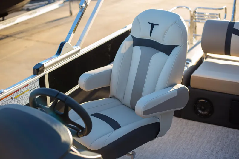 Slide: The Image of Captain's chair on 2025 Trifecta 24UL CS pontoon boat, featuring sleek design and comfort. - 16