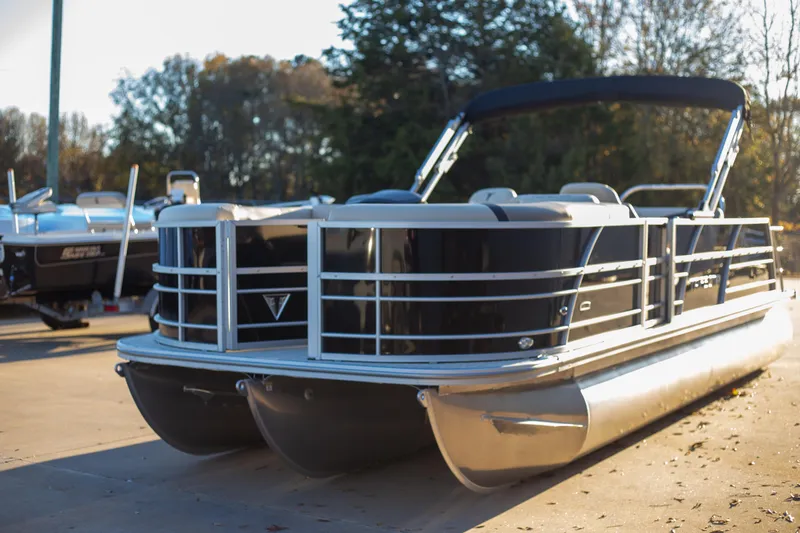 Slide: The Image of 2025 Trifecta 24UL CS pontoon boat in outdoor setting. - 5