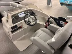 Slide: The Image of 2024 Crest Classic DLX 200 boat interior with steering console and seating. - 10