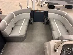 Slide: The Image of Interior of 2024 Crest Classic DLX 200 pontoon boat with gray seating. - 12