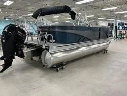 Slide: The Image of 2024 Crest Classic DLX 200 pontoon boat in showroom, side view. - 5