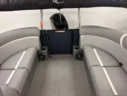 Slide: The Image of 2024 Crest Classic DLX 200 boat interior with gray seating and canopy. - 9