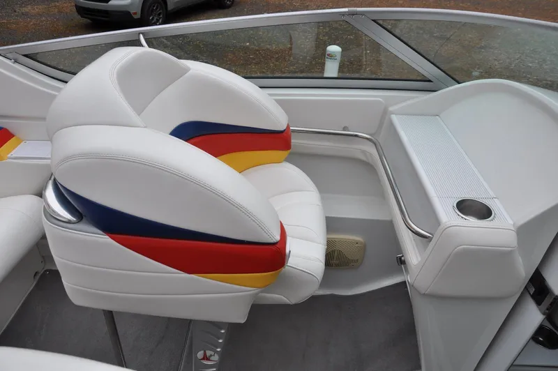 Slide: The Image of 2006 Formula 271 FASTech boat interior with colorful seating and cup holder. - 11