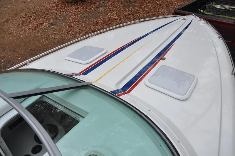 Slide: The Image of 2006 Formula 271 FASTech boat with colorful stripes on deck. - 12