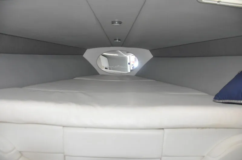Slide: The Image of Interior cabin of 2006 Formula 271 FASTech boat, featuring a comfortable sleeping area. - 17