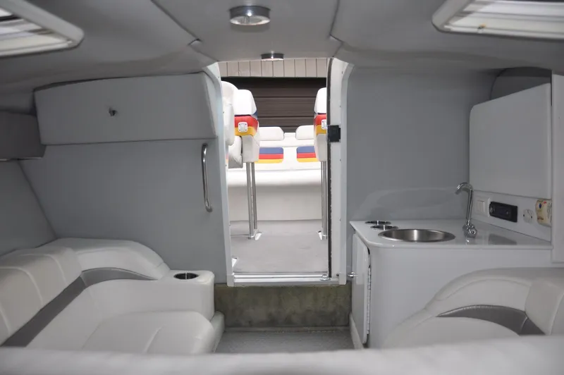 Slide: The Image of 2006 Formula 271 FASTech boat interior with seating and kitchenette. - 18