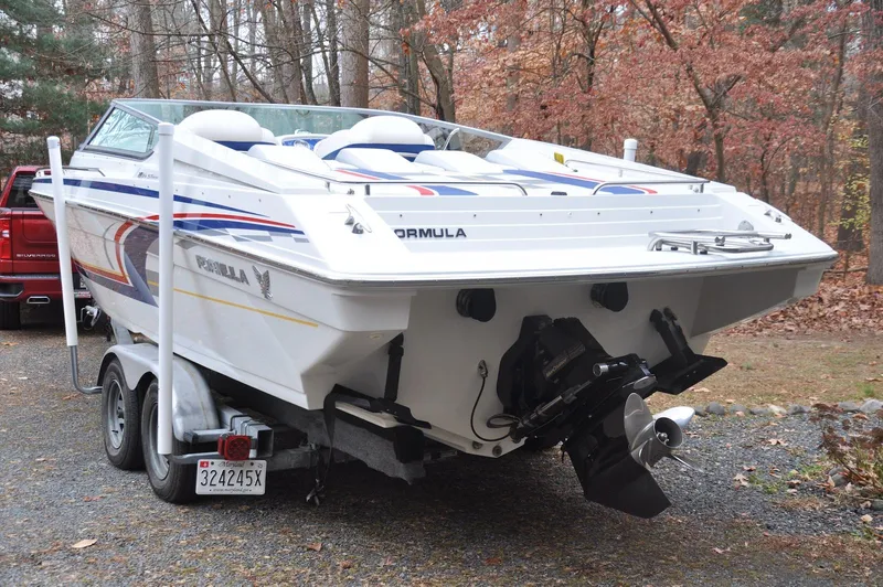 Slide: The Image of 2006 Formula 271 FASTech boat on trailer in wooded area. - 5