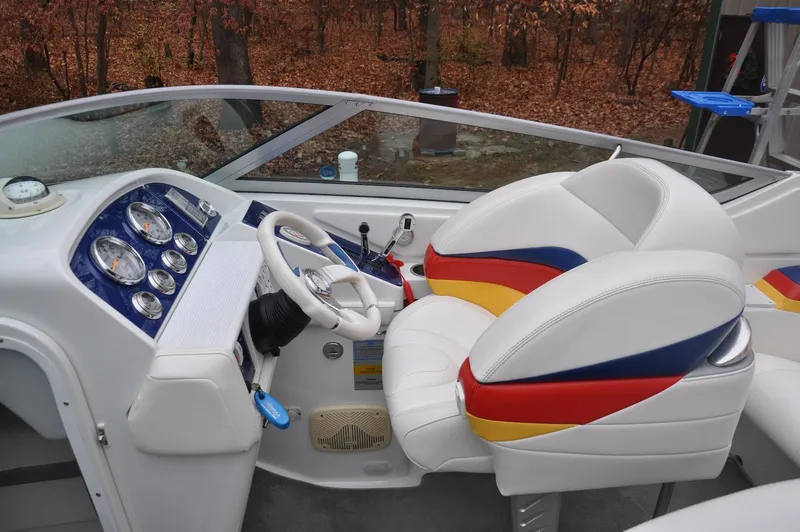 Slide: The Image of 2006 Formula 271 FASTech boat cockpit with colorful seating and dashboard controls. - 9