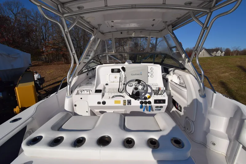 Slide: The Image of 2005 Donzi 38 ZSF boat cockpit with Garmin navigation system and white seating. - 11