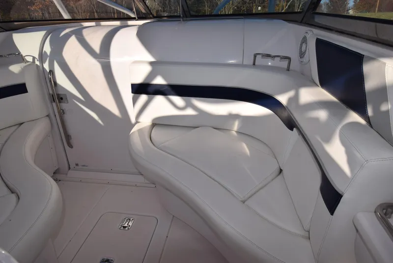 Slide: The Image of Interior of a 2005 Donzi 38 ZSF boat with white and navy seating. - 32