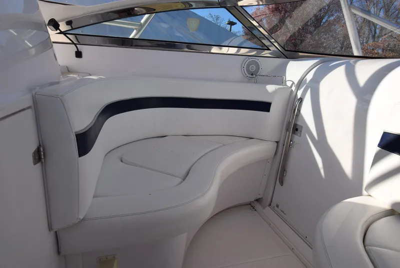 Slide: The Image of 2005 Donzi 38 ZSF boat interior with white seating and blue accents. - 33
