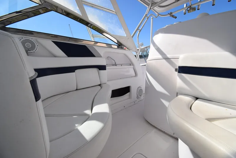 Slide: The Image of Interior of 2005 Donzi 38 ZSF boat with white seating and blue accents. - 34