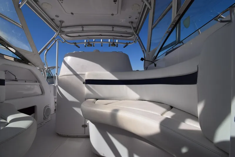 Slide: The Image of Interior of a 2005 Donzi 38 ZSF boat with white seating and blue accents. - 44
