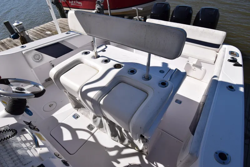Slide: The Image of 2005 Donzi 38 ZSF boat interior with helm seating and control panel. - 48