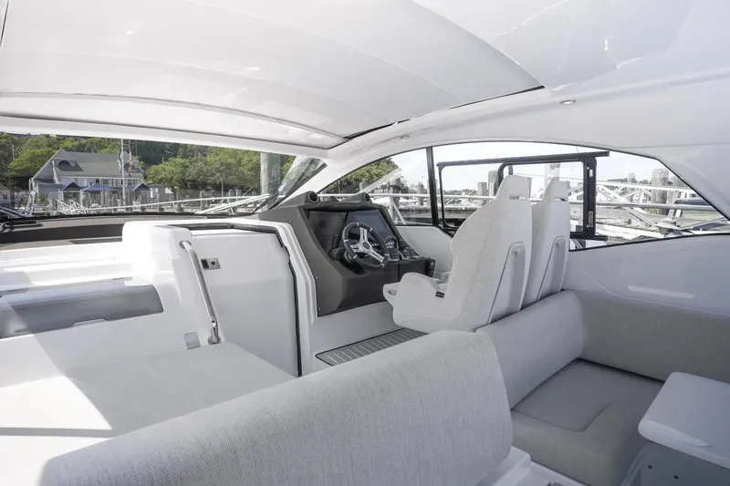 Slide: The Image of Interior of 2026 Azimut Atlantis 45 yacht, featuring modern helm and seating area. - 16