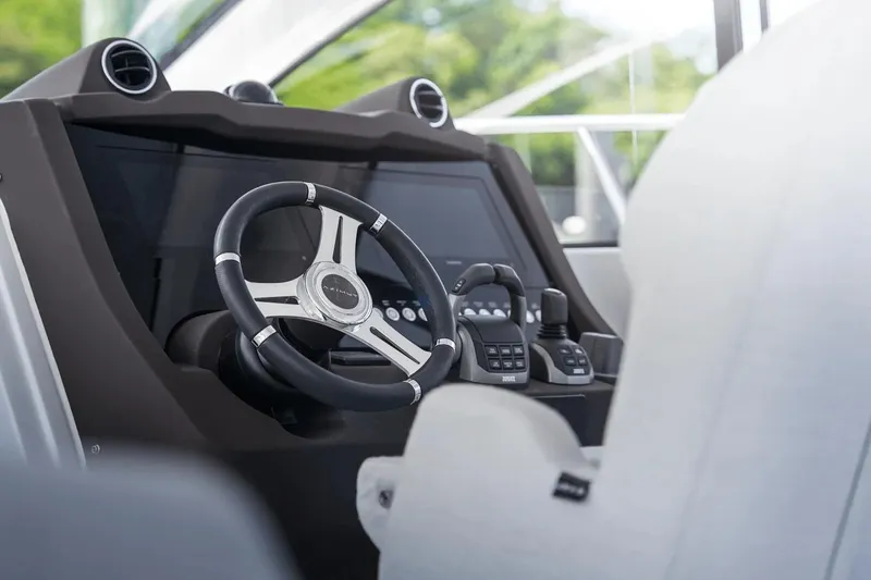 Slide: The Image of 2026 Azimut Atlantis 45 yacht helm with modern steering and controls. - 19