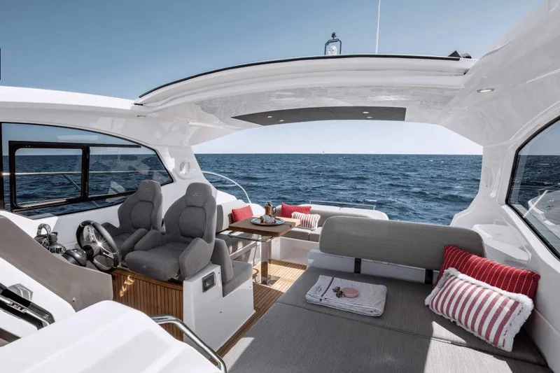 Slide: The Image of Luxurious 2026 Azimut Atlantis 45 yacht interior with ocean view, featuring plush seating and elegant design. - 25